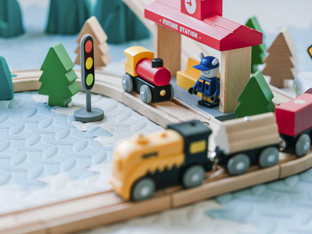 Wooden train set with level crossing